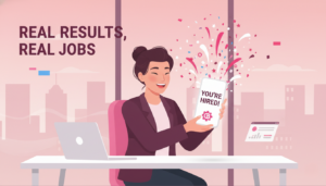 Illustration of a happy young professional woman at her desk, holding a smartphone displaying a "YOU'RE HIRED!" message, surrounded by celebratory confetti in a pink and red office setting.