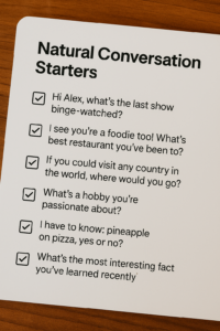 Notepad titled “Natural Conversation Starters” with six checkbox prompts (shows, restaurants, travel, hobbies, pizza, fun fact) on a wood desk.
